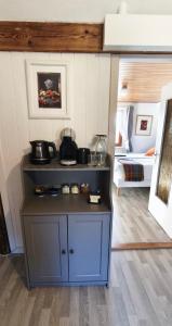 a kitchen with a blue cabinet in a room at DANDELION Bed & Breakfast in Ribeauvillé +8 photos