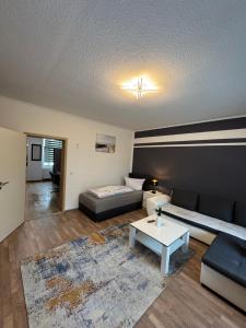 a living room with a couch and a table at Ferienwohnung Florion 2 in Bernburg