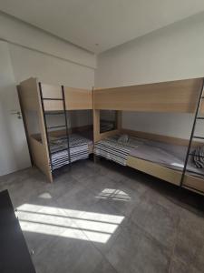 a room with two bunk beds in a room at 2 bedroom home sea view in Pyla