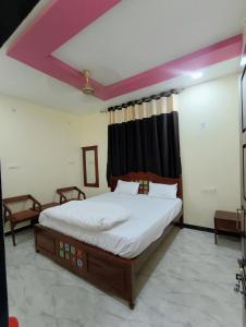 a bedroom with a large bed in a room at Hotel Suraj Palace And Restaurant in Rūpaheli