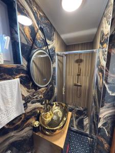 a bathroom with a sink and a mirror at Apartments Kenan in Plav +57 photos