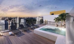 a balcony with a swimming pool on top of a building at Studio aconchegante- Japão liberdade in São Paulo