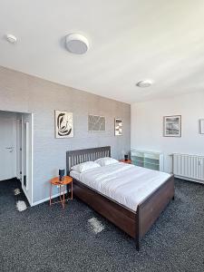 a bedroom with a large bed in a room at Keyless Hotel - Van Gaver in Brussels