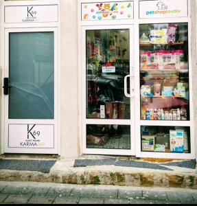 a store with two glass doors with food inside at GuestHouse3 Karma369 in Plovdiv