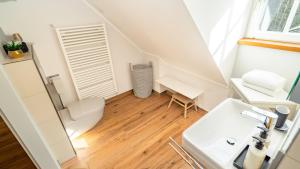a small bathroom with a sink and a toilet at Erasmus 1901 Apartments in Trassem +43 photos