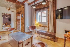a room with chairs and a table and a window at La Planète 612 - Vue Capitole in Toulouse