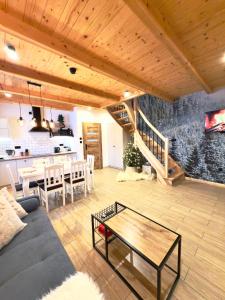 a living room with a couch and a table at Sielanka u Stanka in Szaflary