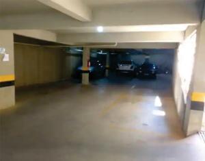 an empty parking garage with cars parked in it at Flats da Júnia, ótimo benefício, fácil check-in, wifi , tv, ar, garagem, localizacao in Lagoa Santa +1 photo
