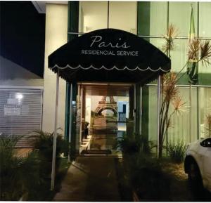 a restaurant with an awning in front of a building at Flats da Júnia, ótimo benefício, fácil check-in, wifi , tv, ar, garagem, localizacao in Lagoa Santa