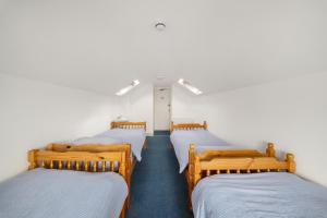 a group of four beds in a room at Breakwater Hostel in Newquay +38 photos