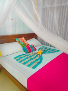 a large bed with at Dream Haven Mirissa in Mirissa +9 photos