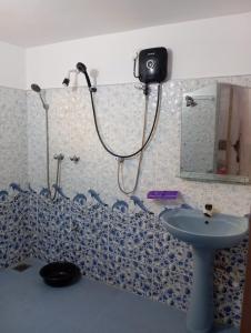 a bathroom with a shower and a sink at Dream Haven Mirissa in Mirissa