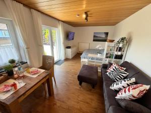 a living room with a couch and a table at Ferienwohnungen Mamat in Haltern