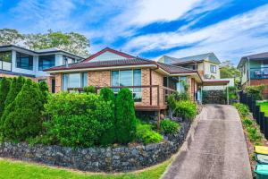 a home in a subdivision with bushes at Wangi Waters and Views in Wangi Wangi
