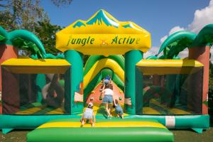 a group of people playing on an inflatable playground at Camping Le Bois Soleil - Mobil home 3 pièces 4 personnes + TV MAE-4364 in Les Sables-d'Olonne