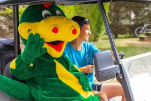 a person sitting in a vehicle with a mascot at Camping Le Bois Soleil - Mobil home 3 pièces 4 personnes + TV MAE-4364 in Les Sables-d'Olonne +36 photos