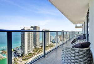 a balcony with a view of the ocean at 3BR Oceanview HYDE - Free Parking, No Resort Fee in Hollywood