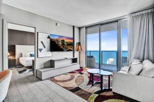 a living room with a view of the ocean at 3BR Oceanview HYDE - Free Parking, No Resort Fee in Hollywood