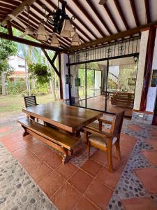 a wooden table and two chairs on a patio at El Encanto in Olaya