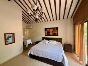 a bedroom with a bed and a ceiling at El Encanto in Olaya +34 photos