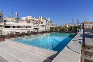 a swimming pool on the roof of a building at The Corner Hotel in Barcelona