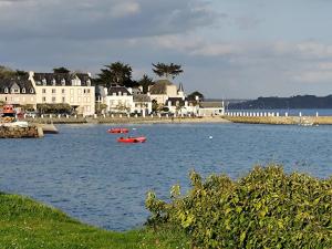 a large body of water with boats in it at cote d'armor in Plestin-les-Grèves +11 photos