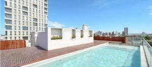 a swimming pool on the roof of a building at Metra DS Puerto Norte in Rosario