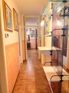 a hallway of a room with paintings on the walls at Art & Relax House in Gallipoli +37 photos