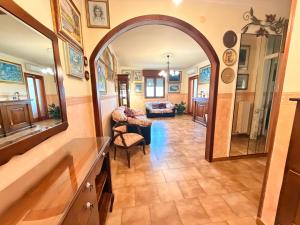 a hallway with an archway and a living room at Art & Relax House in Gallipoli