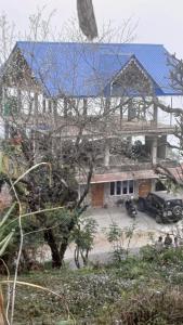 a house with a car parked in front of it at Aashirwad homestay in Aritar