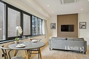 a living room with a couch and a table at Platform One Apartments - Caversham in Reading