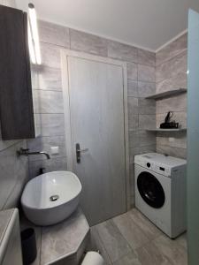 a bathroom with a washing machine and a washer at Villa Oxana in Limenas +48 photos