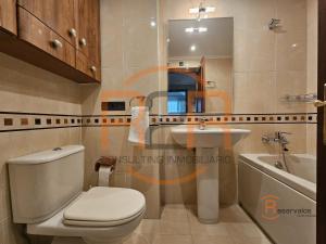a bathroom with a toilet and a sink at R2R - El Raitán - 1A122 in Gijón +18 photos