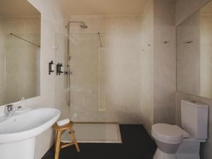 a bathroom with a sink toilet and a shower at Casa Solayme Vitória in Lisbon +26 photos