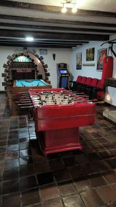 a room with ping pong tables in a room at Azkorri Beach House 10 rooms Bilbao in Getxo