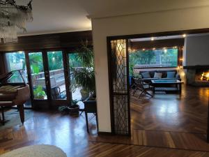 a living room with a fireplace in a house at Azkorri Beach House 10 rooms Bilbao in Getxo