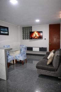 a living room with a couch and a table at Peruyork Arbnb - Calle España in Chiclayo