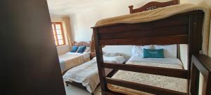 a bedroom with two bunk beds in a room at HOTEL El MONARCA in Tunja