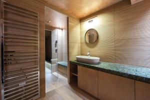 a bathroom with a sink and a shower at Chalet Les Solans in Les Allues +14 photos