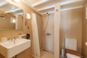 a bathroom with a sink and a shower at Kamari Guest House Corfu in Corfu International Airport I Kapodistrias +26 photos