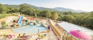a rendering of a water park with a slide at ZEcamping 4 étoiles familial avec piscine couverte in Laroque-des-Albères