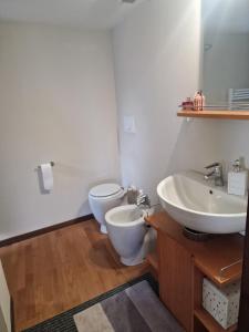 a bathroom with a sink and a toilet at Ginetta in Madonna del Sasso