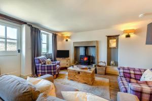 a living room with a couch and a tv at 2 Bed in Middleton oc-m29515 in Middleton