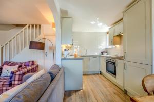 a living room with a couch and a kitchen at 2 Bed in Middleton oc-m29515 in Middleton