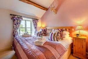 a bedroom with a bed with towels on it at 2 Bed in Middleton oc-m29515 in Middleton