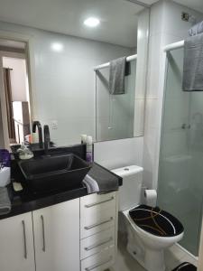 a bathroom with a sink and a toilet and a shower at Casa Rebello - Pousada in Itajaí +117 photos