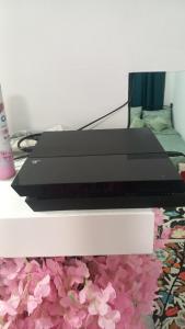a laptop computer sitting on top of a table at House Marios airport 3 in Spata +1 photo