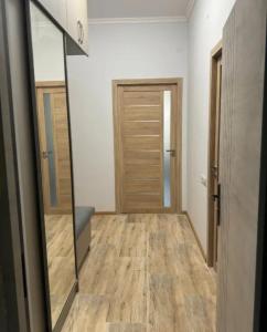 an empty room with a mirror and a door at Sweet and New Apartment , Cit Center, Best Location in Yerevan +3 photos