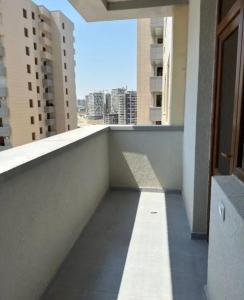 a balcony of a building with a view of buildings at Sweet and New Apartment , Cit Center, Best Location in Yerevan