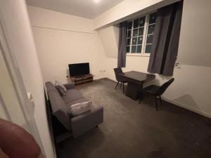 a living room with a couch and a table at One Bedroom flat in Doncaster Prime Location in Doncaster